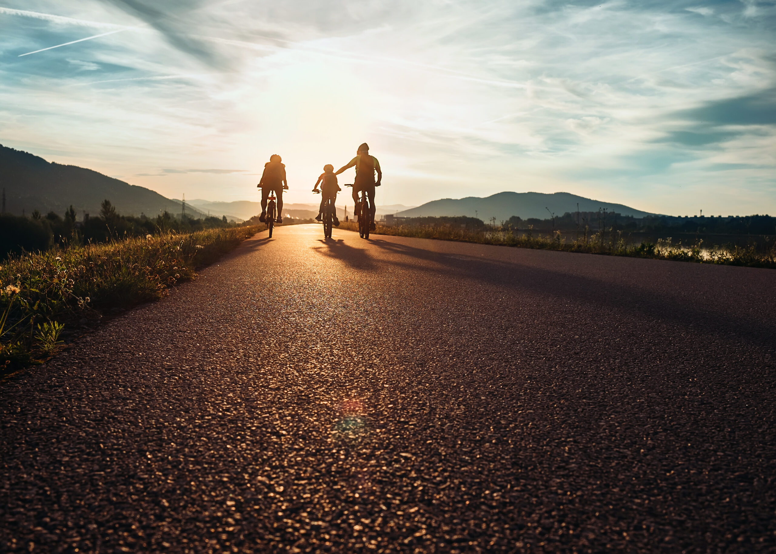 A family riding bikes.