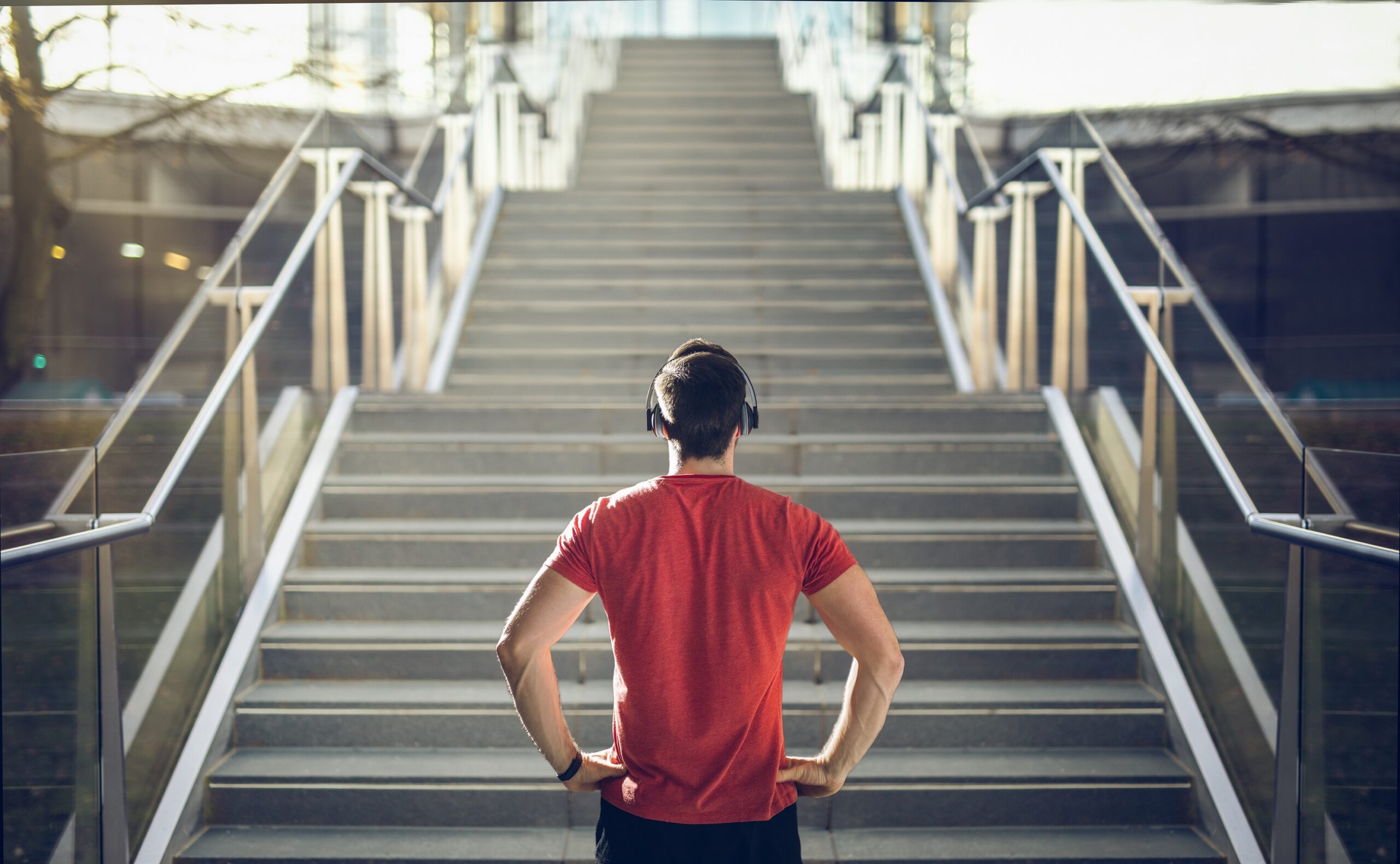 Man looking up stairs.