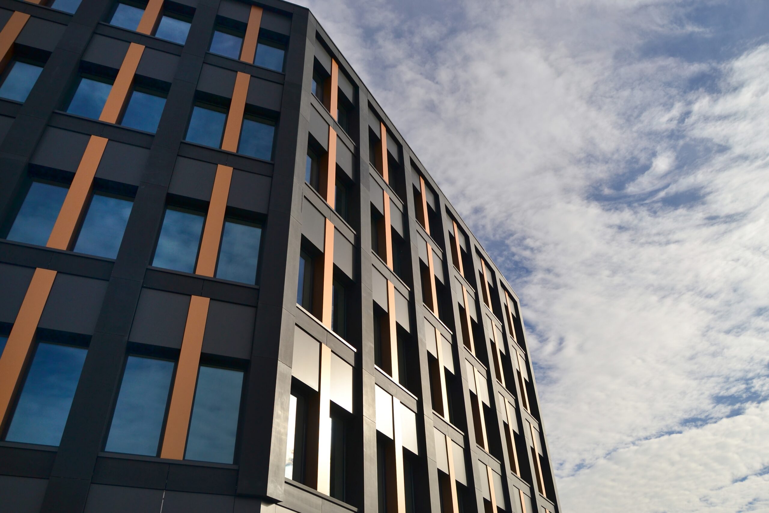 An office block against a blue sky.