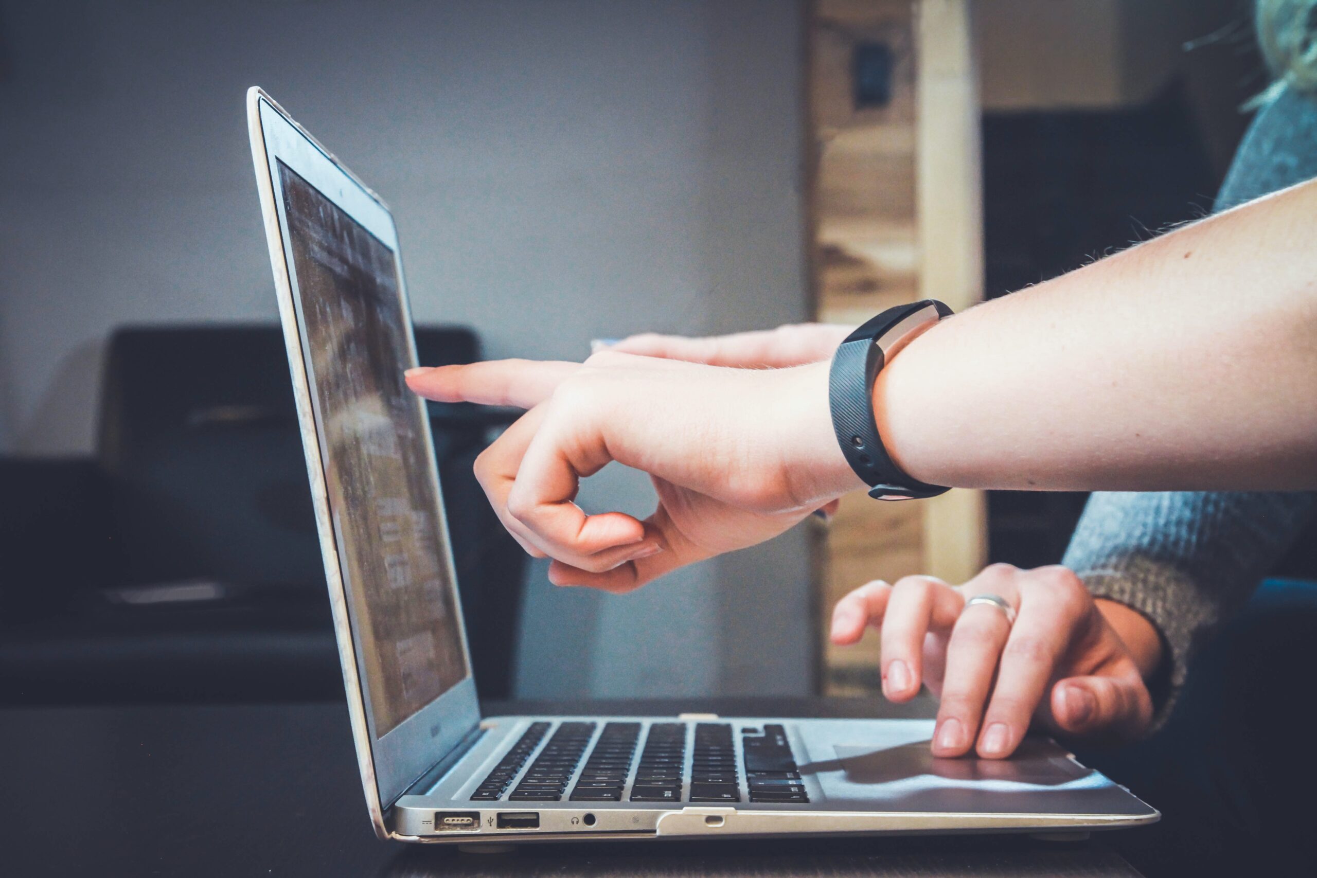 Young professionals working together on laptop