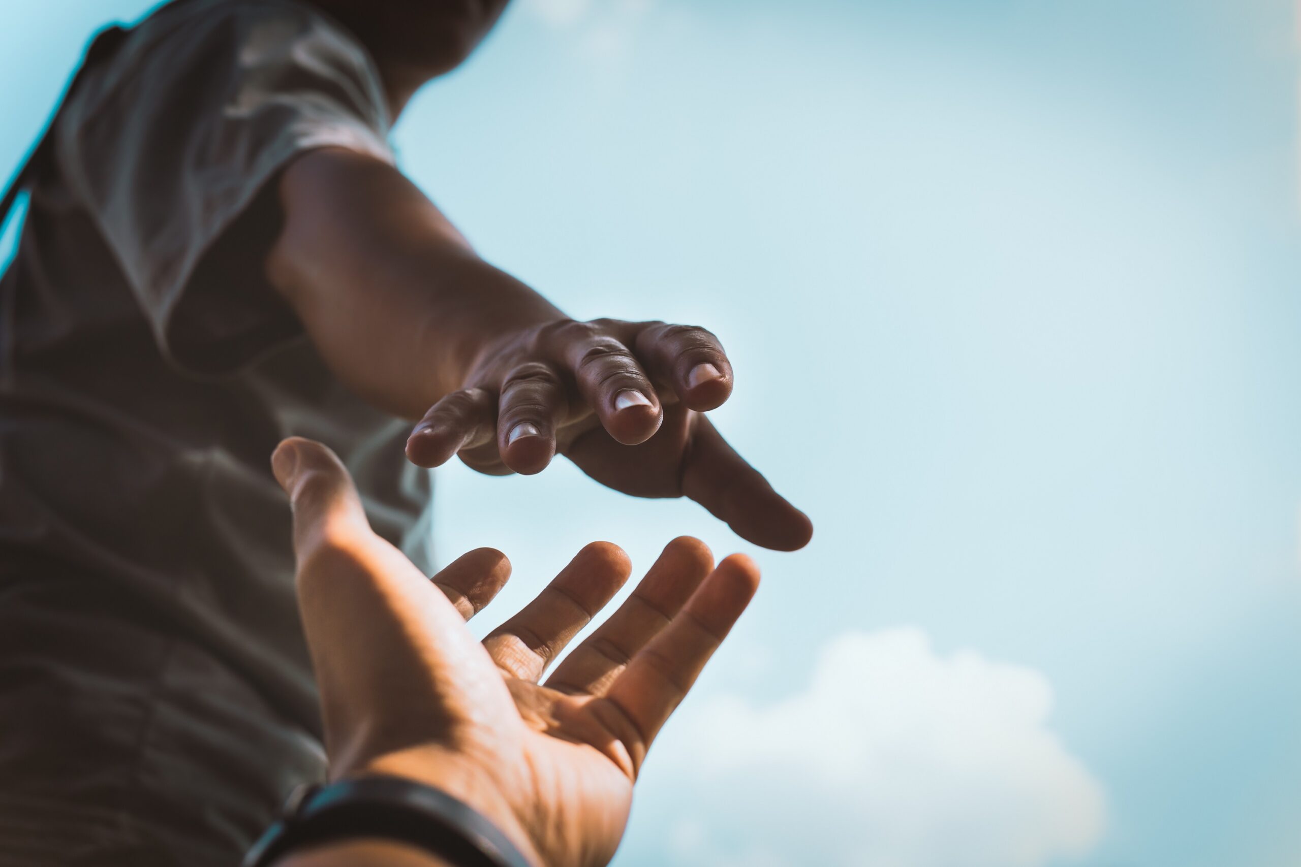 Reaching out a hand.