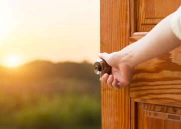 An open door to countrside.