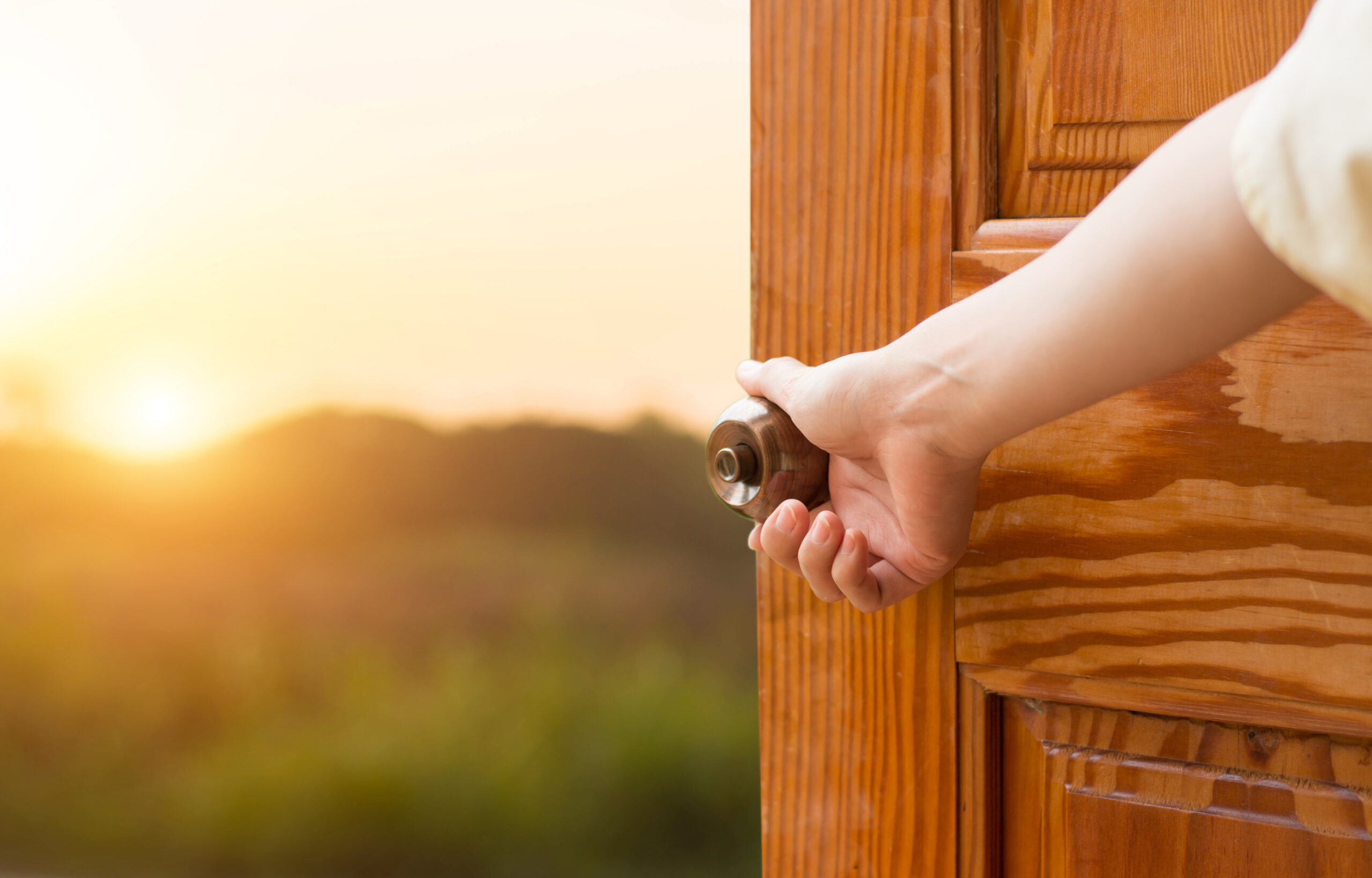 An open door to countrside.